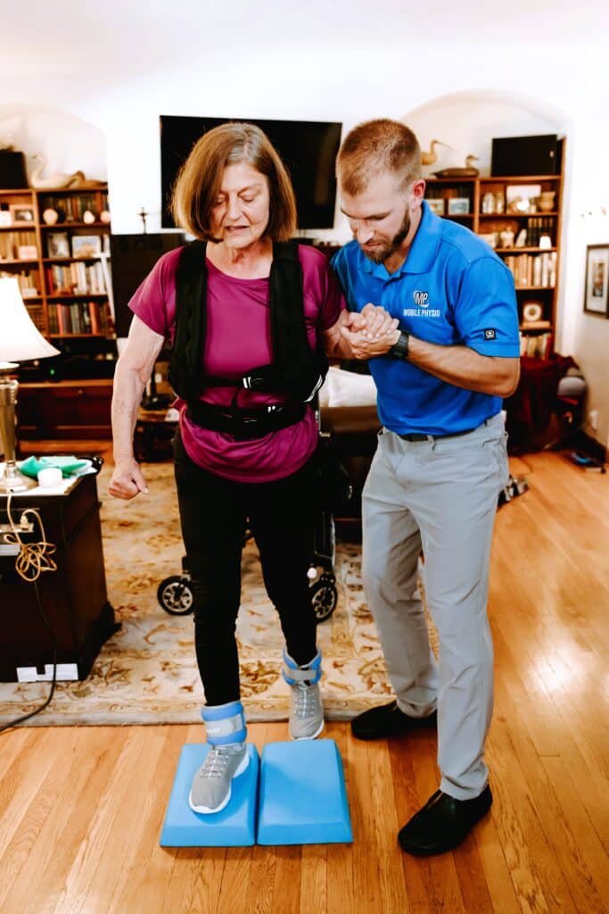 In-House Physical Therapist - Dr Charles helping patient balance